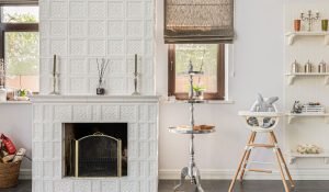 fireplace is flanked by built-in shelving